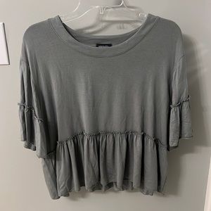 Greyish-green flowy short sleeve top.
